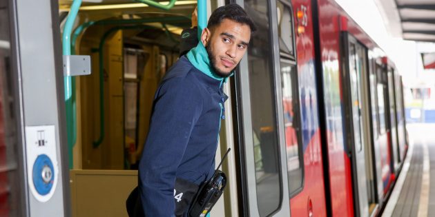 DLR staff member on train