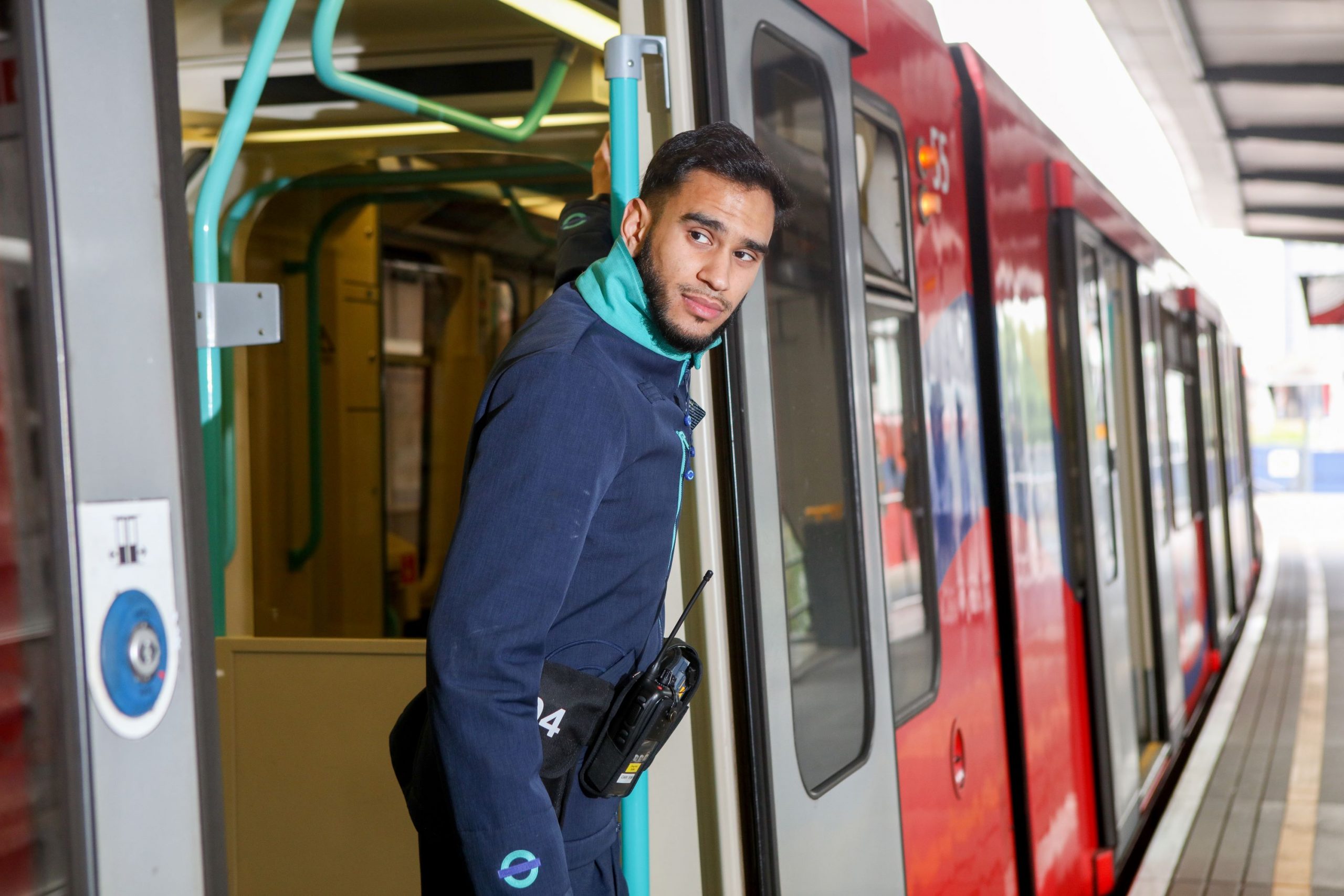 DLR staff member on train